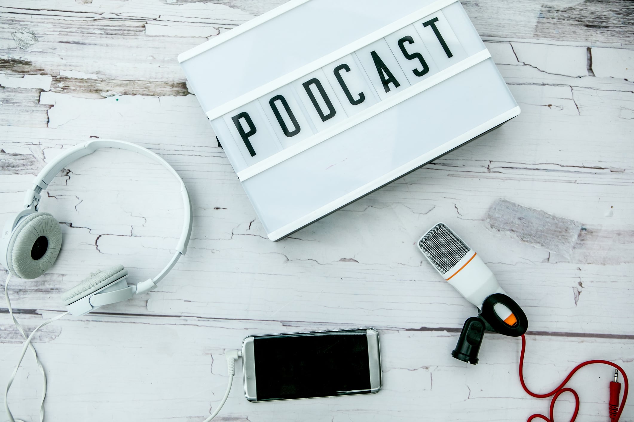 smartphone. headphones, microphone.Podcast concept