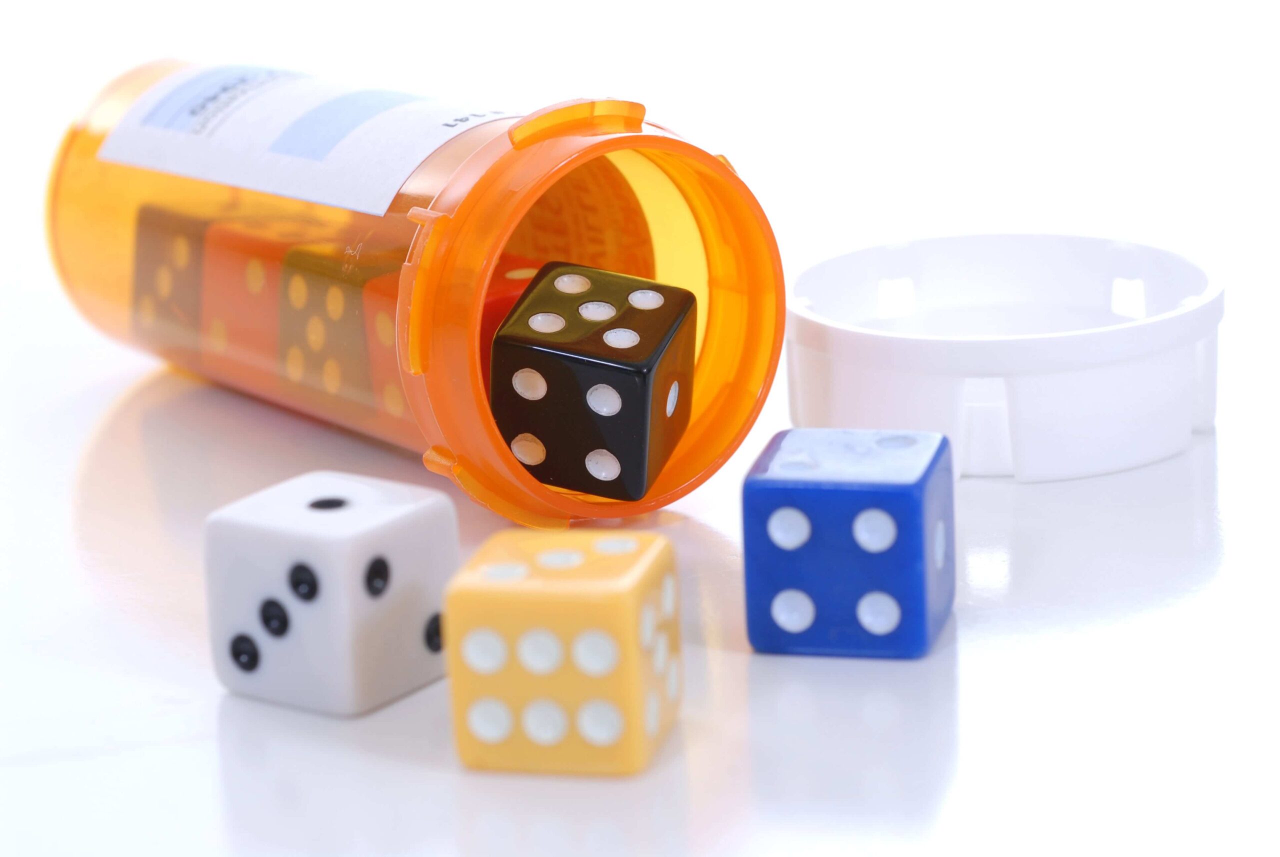 Dice in a prescription drug bottle.
