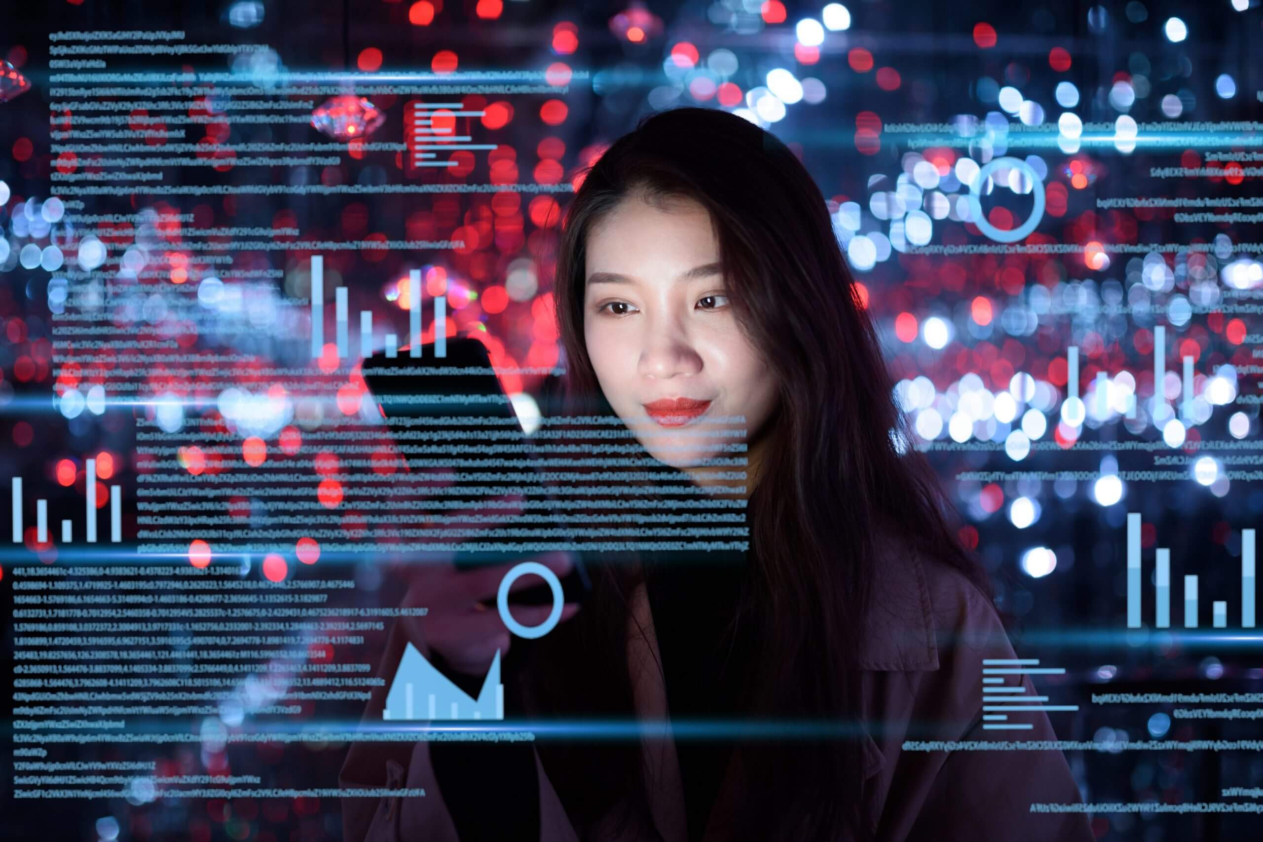 young woman uses mobile phone on virtual visual screen at night