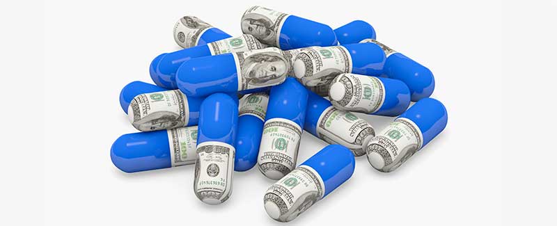 Pills decorated with dollar bills